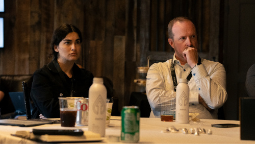 Confluence attendee Darya Montazerinamin and session speaker Rob Sinclair from Wade Trim listen to day one sessions at Lexington’s Fasig-Tipton.