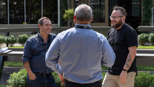 Confluence Lexington 2024 presenters engage in conversation over lunch at historic Thoroughbred horse auction site Fasig-Tipton during day one.